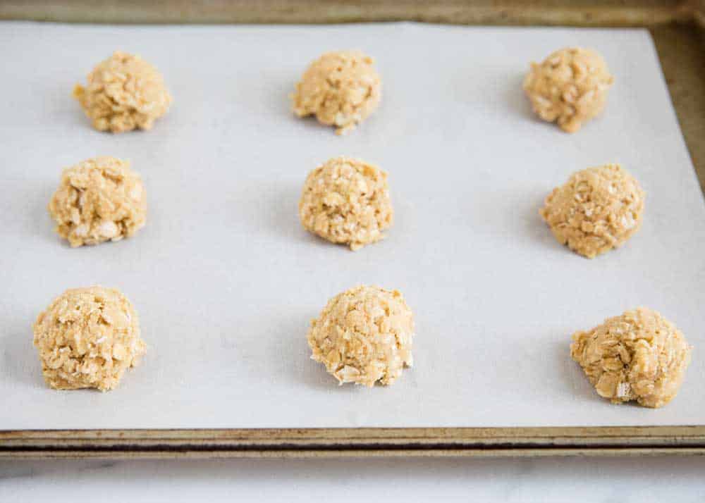 oatmeal cookie dough balls on baking sheet 