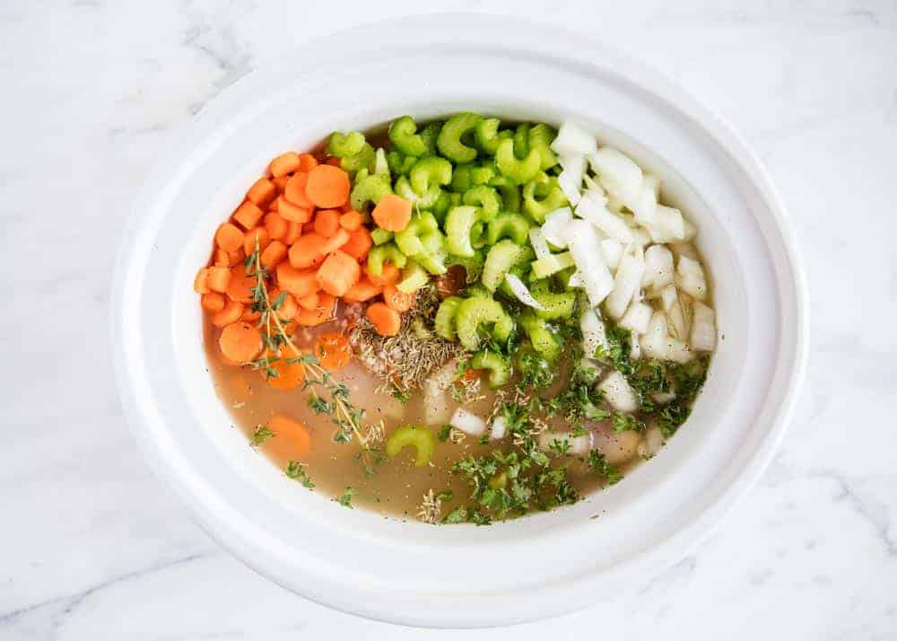 Chicken and rice soup in crockpot.