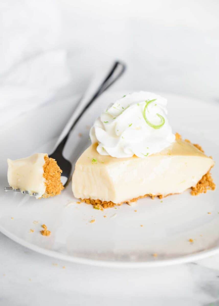 piece of key lime pie on a white plate 