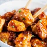 general tso chicken with chopsticks