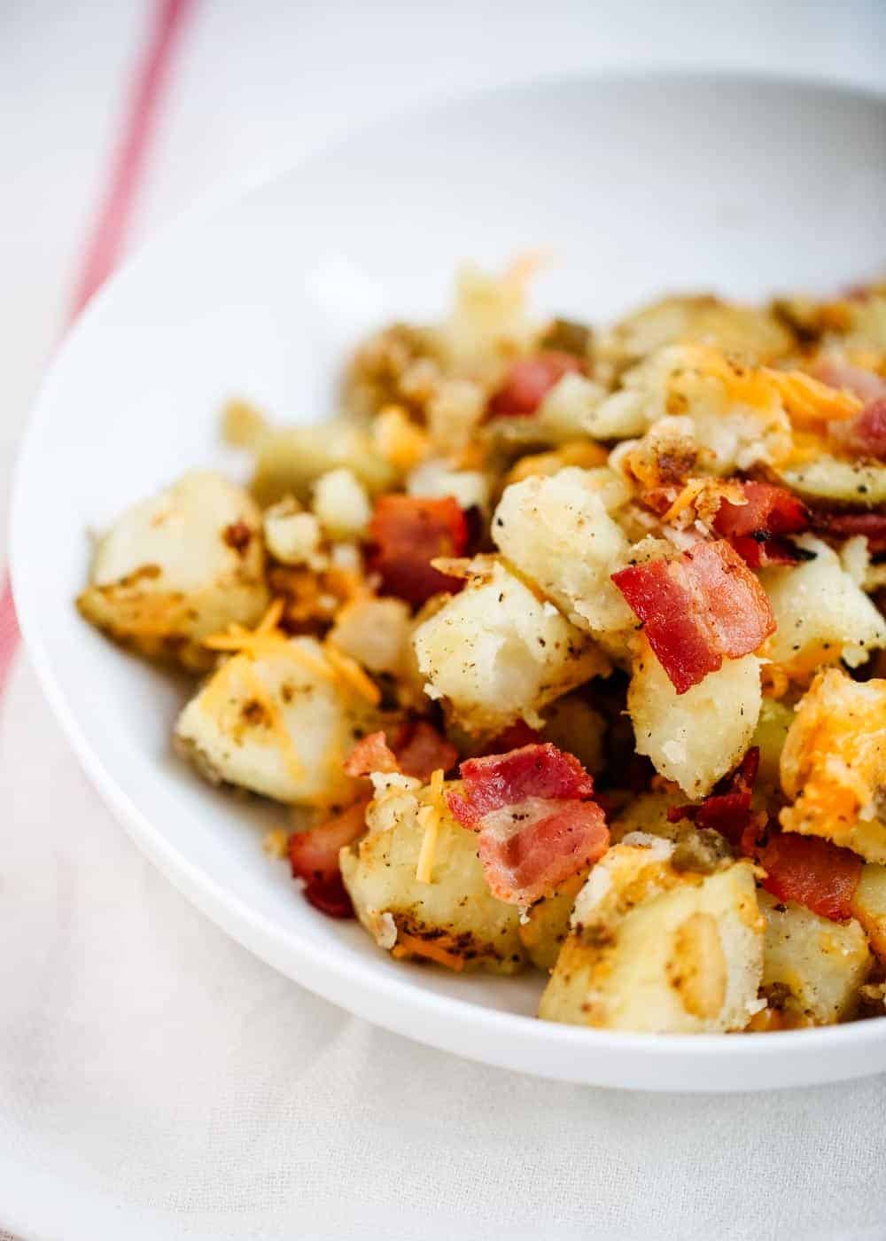 Breakfast potatoes on white plate.