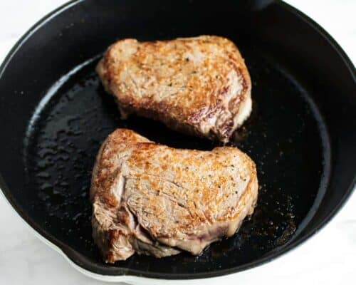 oven baked steak in skillet