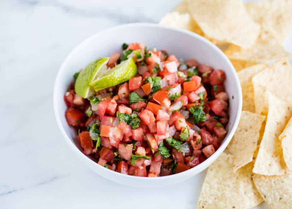 Pico de gallo in white bowl.