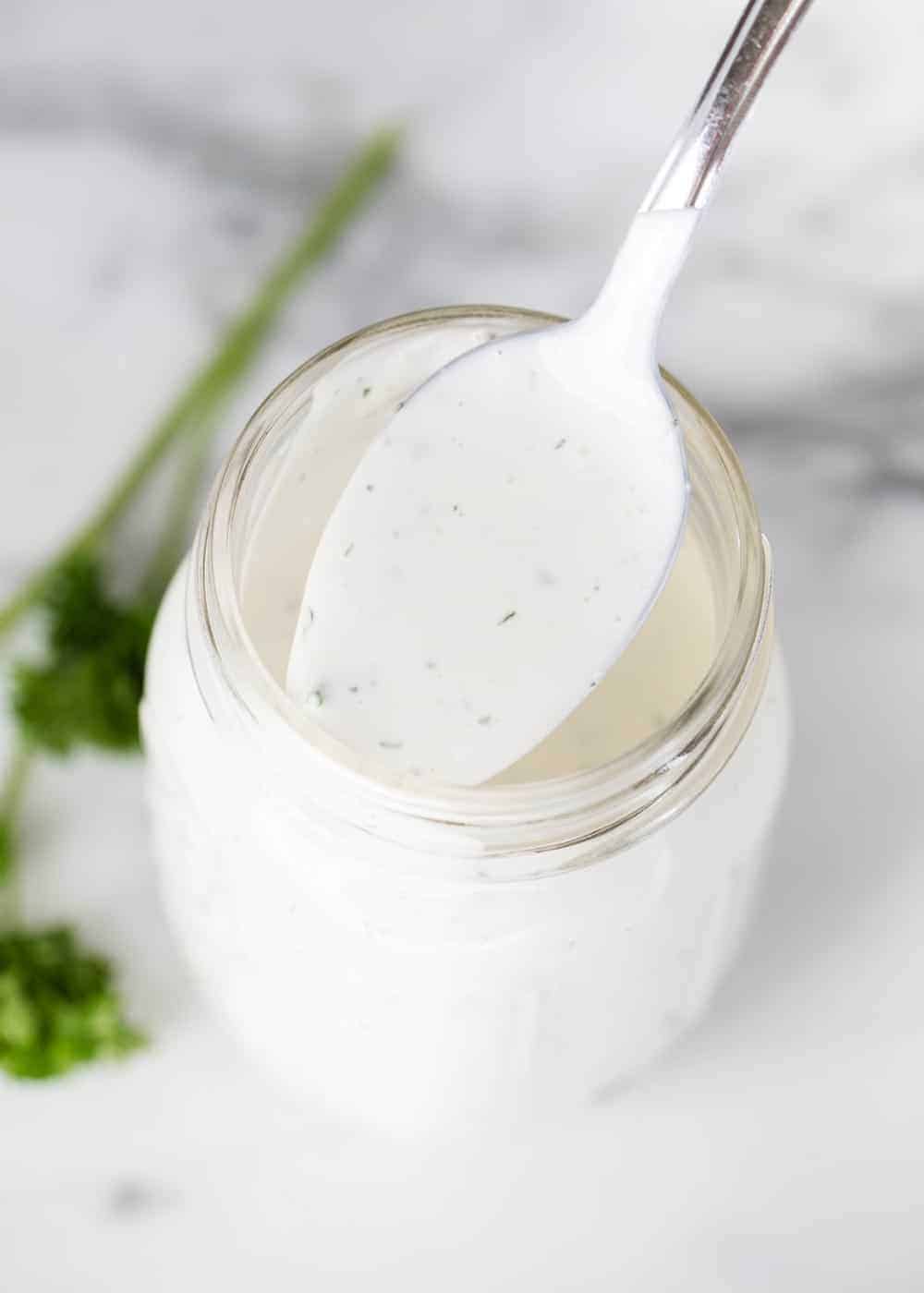 Ranch dressing on spoon.