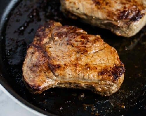 steak in cast iron skillet