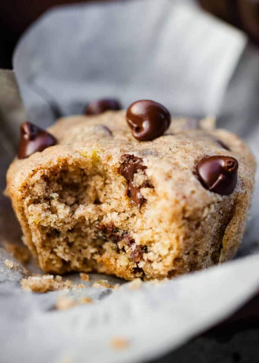 zucchini chocolate chip muffins with a bite taken out 