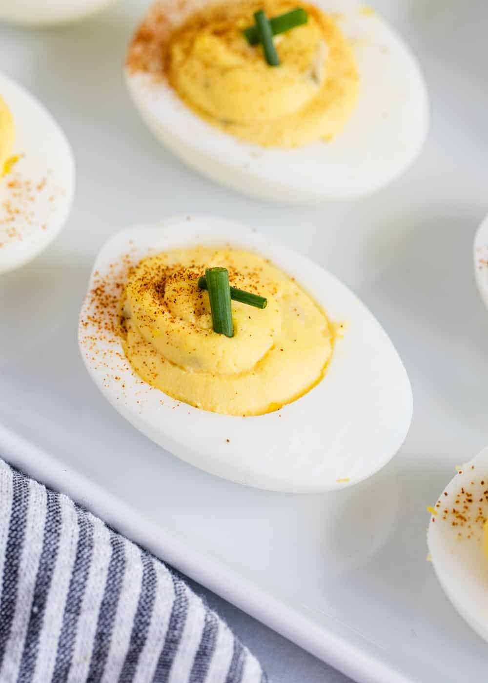 Close up of deviled egg on plate.