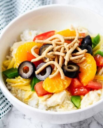 hawaiian haystack in a white bowl with toppings