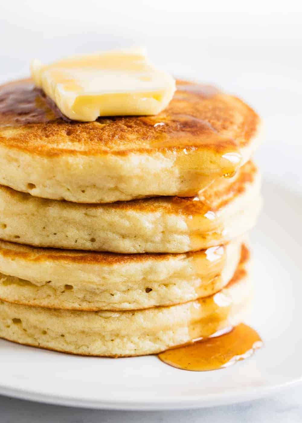 Buttermilk pancakes with butter and syrup. 