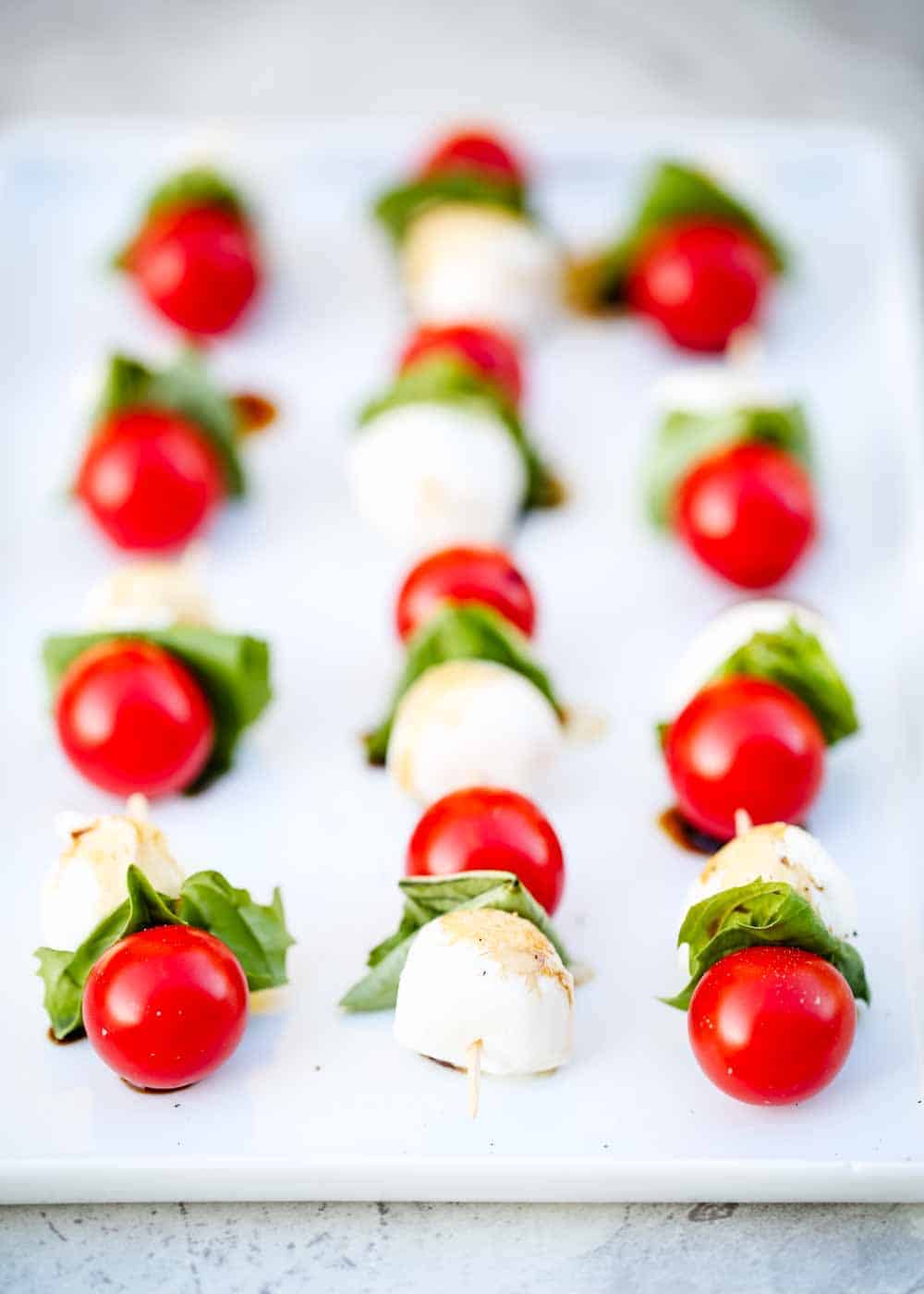 Caprese appetizer on a baking sheet.