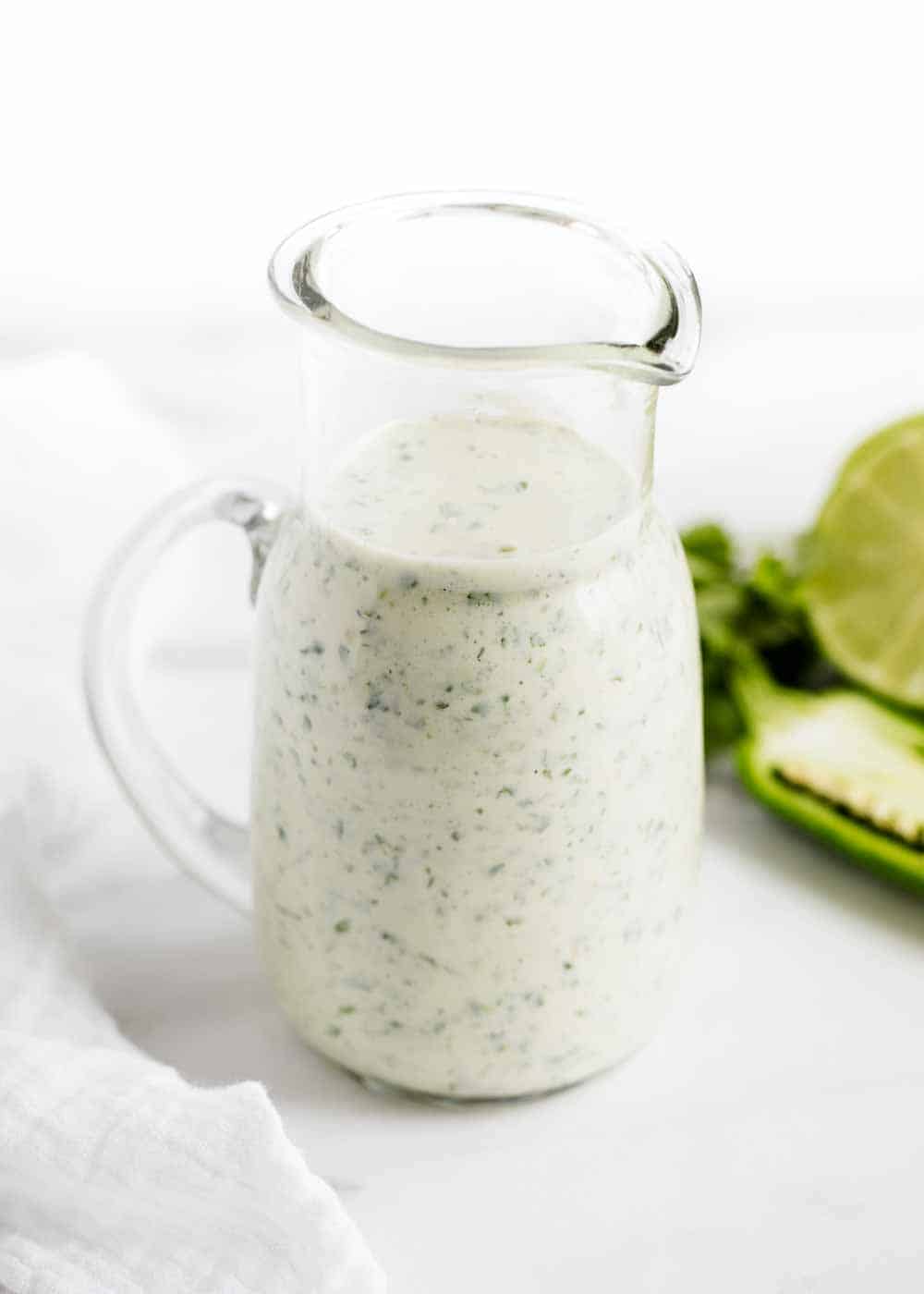 Cilantro lime dressing in glass jar.