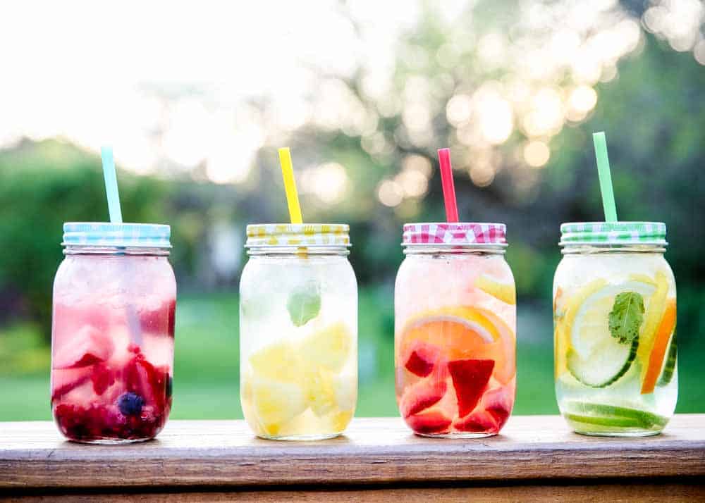 fruit water in mason jar cups