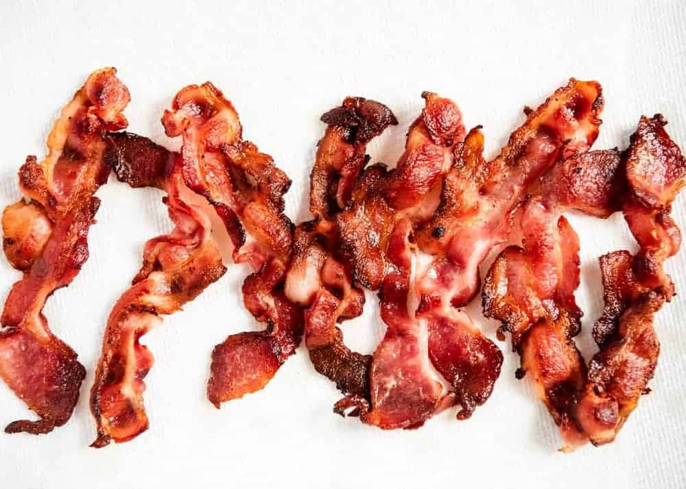 How to Cook Bacon in the Oven Better: Use This Genius Tip to Prevent Soggy  or Greasy Strips 