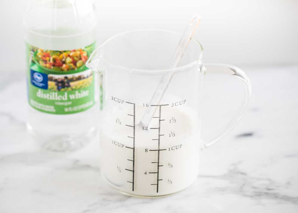 Buttermilk in measuring cup on counter.