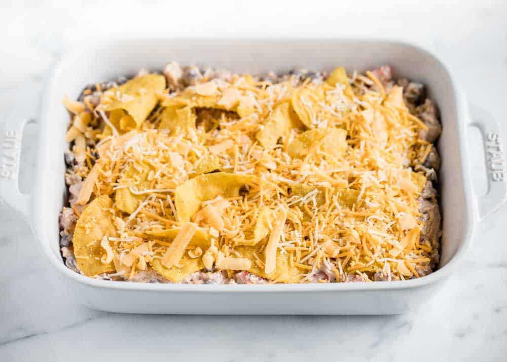 Mexican chicken casserole in pan ready to bake.