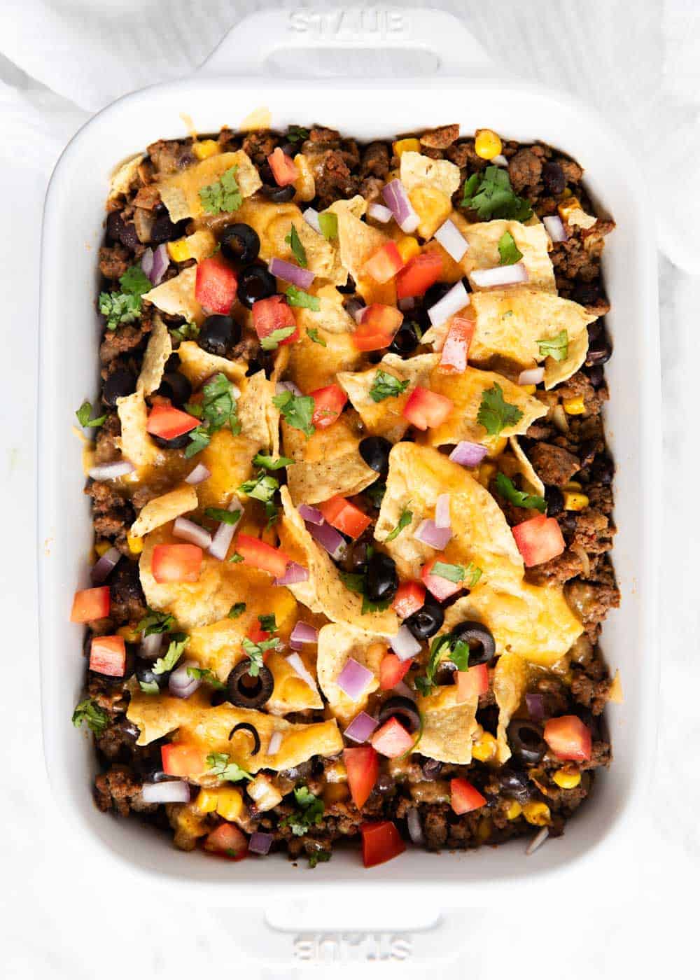 Taco casserole in baking dish.