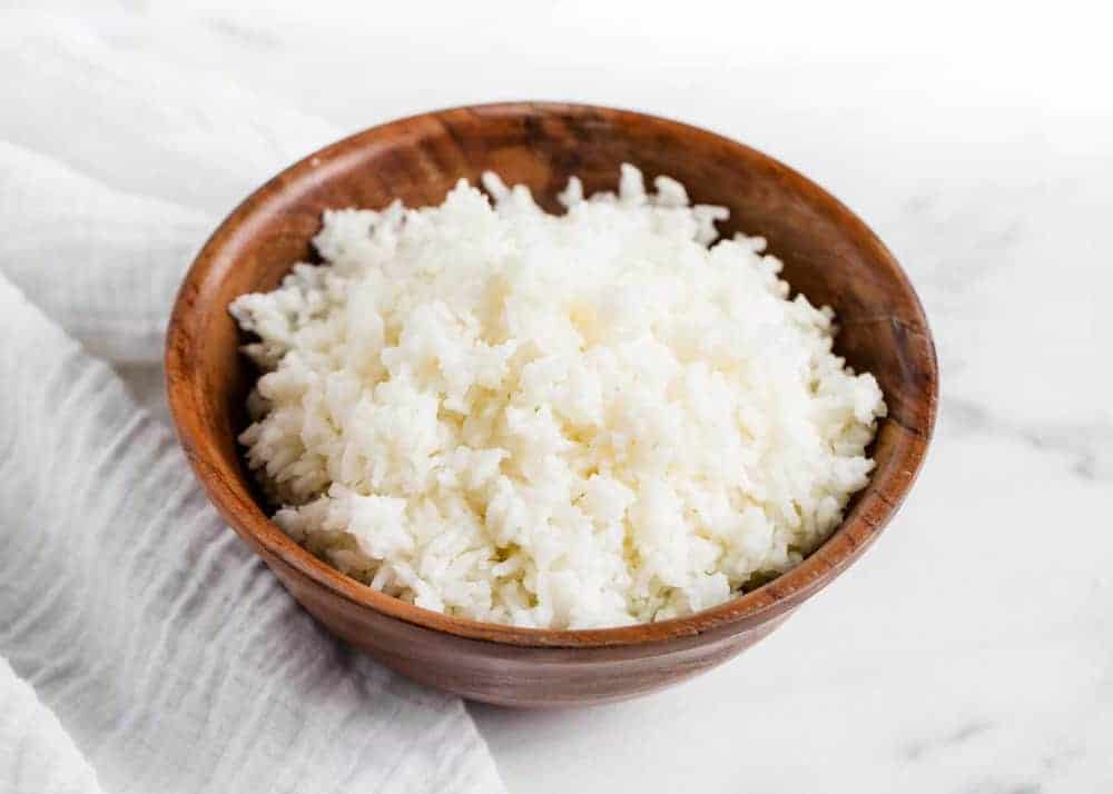 white rice in a wooden bowl