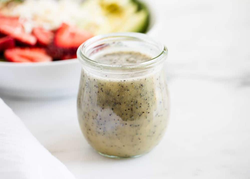 Poppy seed dressing in glass jar.