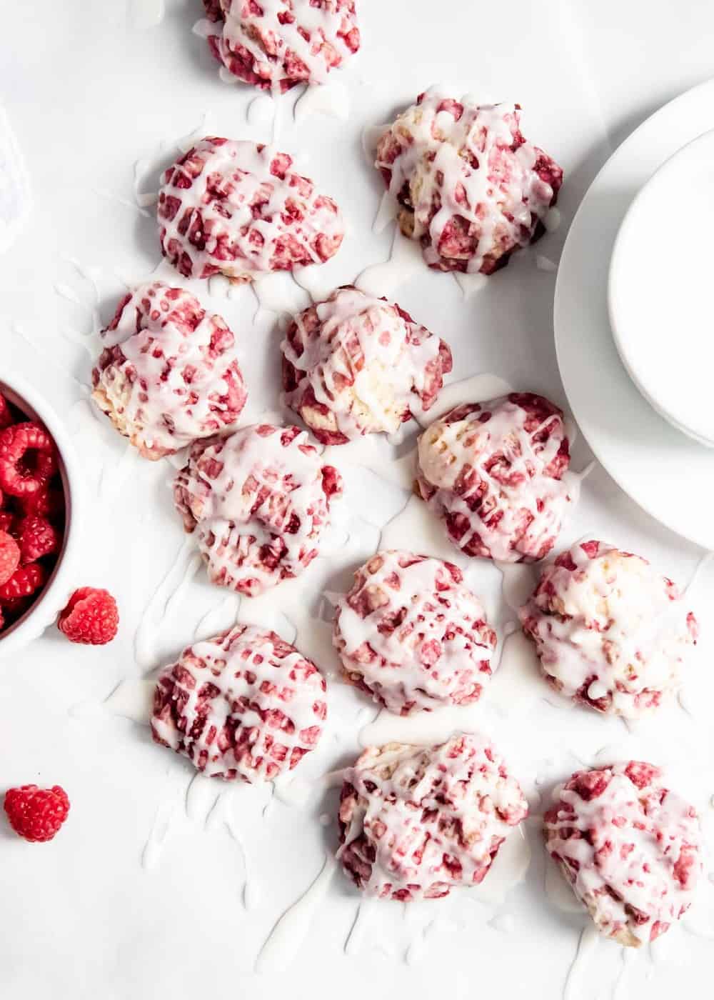Glazed raspberry lemon cookies on counter.