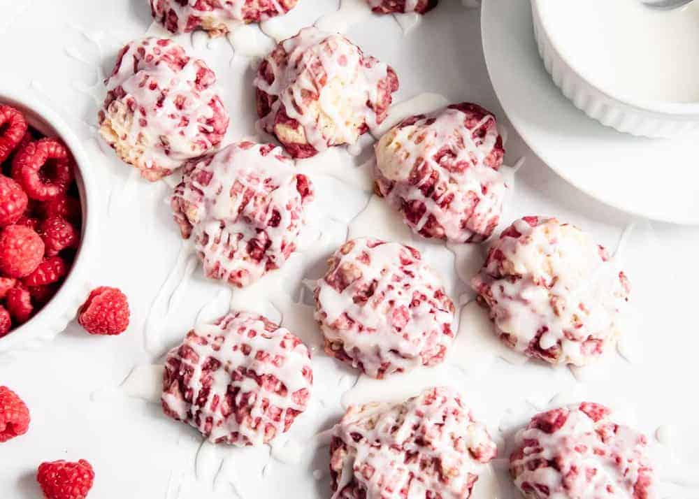 Glazed raspberry lemon cookies on counter.