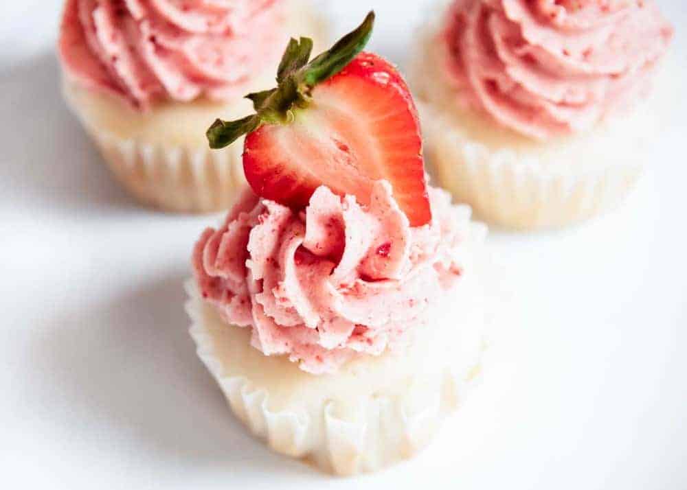 Strawberry Buttercream Frosting - Rich and creamy frosting packed with amazing strawberry flavor. Perfect for frosting cakes, cupcakes, cookies and more! Strawberry buttercream frosting.