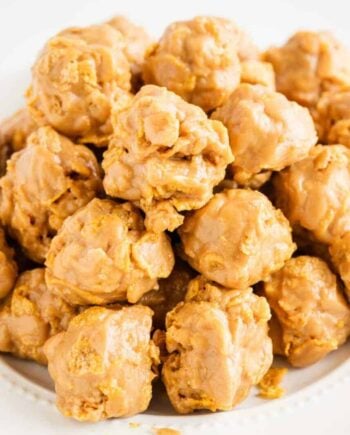stack of cornflake cookies on a white plate