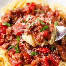 Spaghetti twirled in a fork.