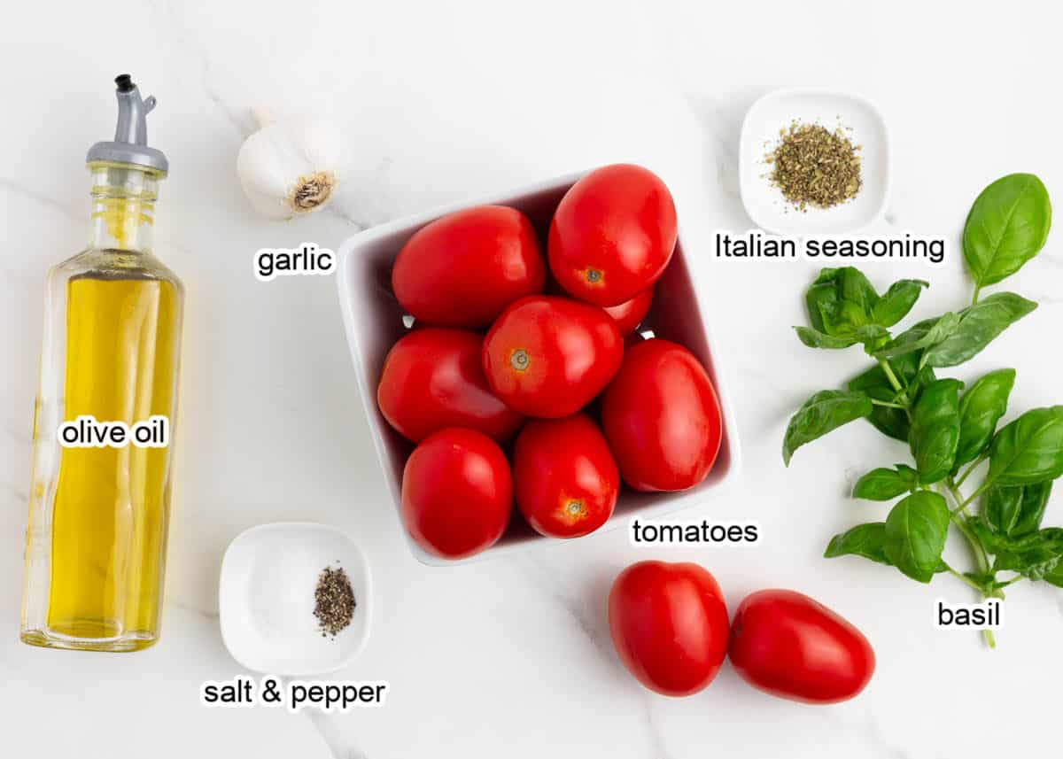 Roasted tomato sauce ingredients on counter.