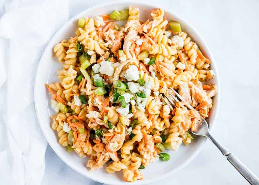 Buffalo chicken pasta salad on a white plate.