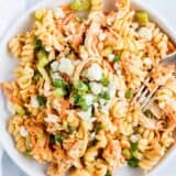 buffalo chicken pasta salad on a white plate with fork