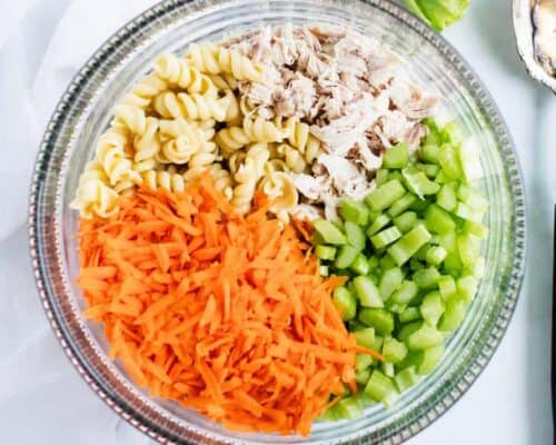 buffalo pasta salad ingredients in a glass bowl