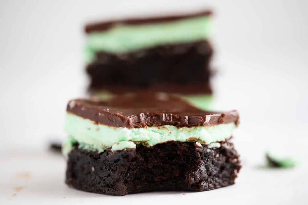 Chocolate mint brownies on a white plate.