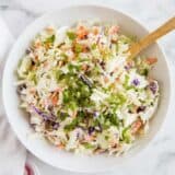 homemade coleslaw in a white bowl