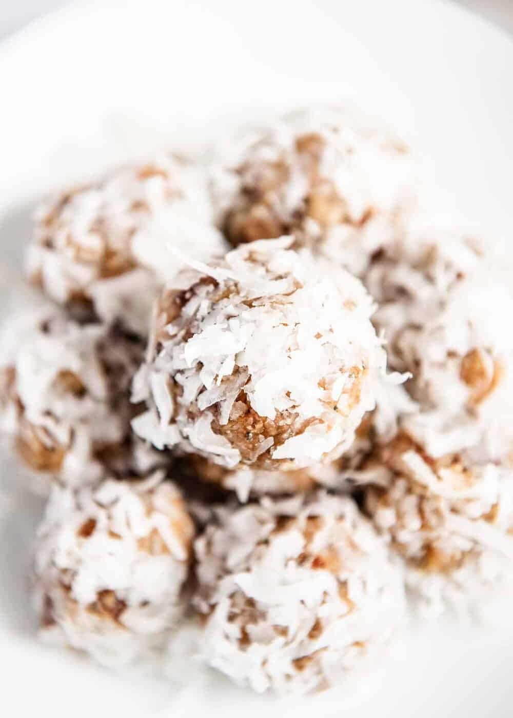 Stack of lemon coconut energy balls.