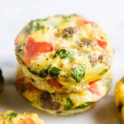 frittata muffins stacked on white plate