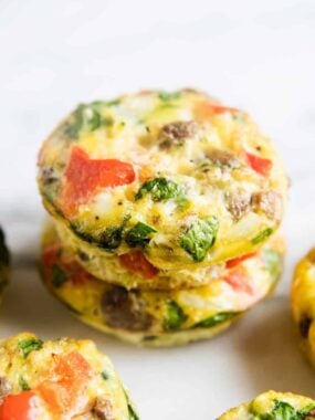 frittata muffins stacked on white plate