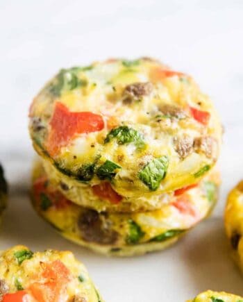 frittata muffins stacked on white plate