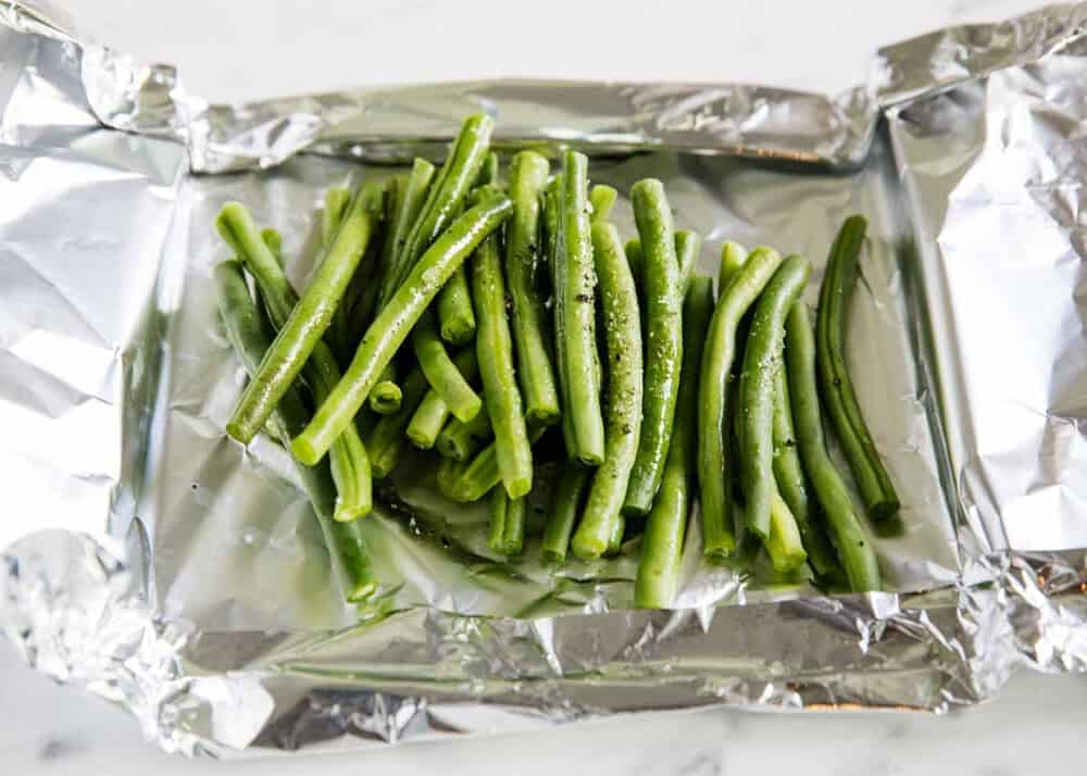 Seasoned green beans in foil.