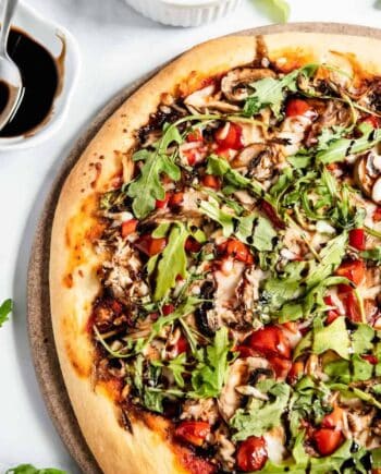 healthy pizza with vegetables and arugula