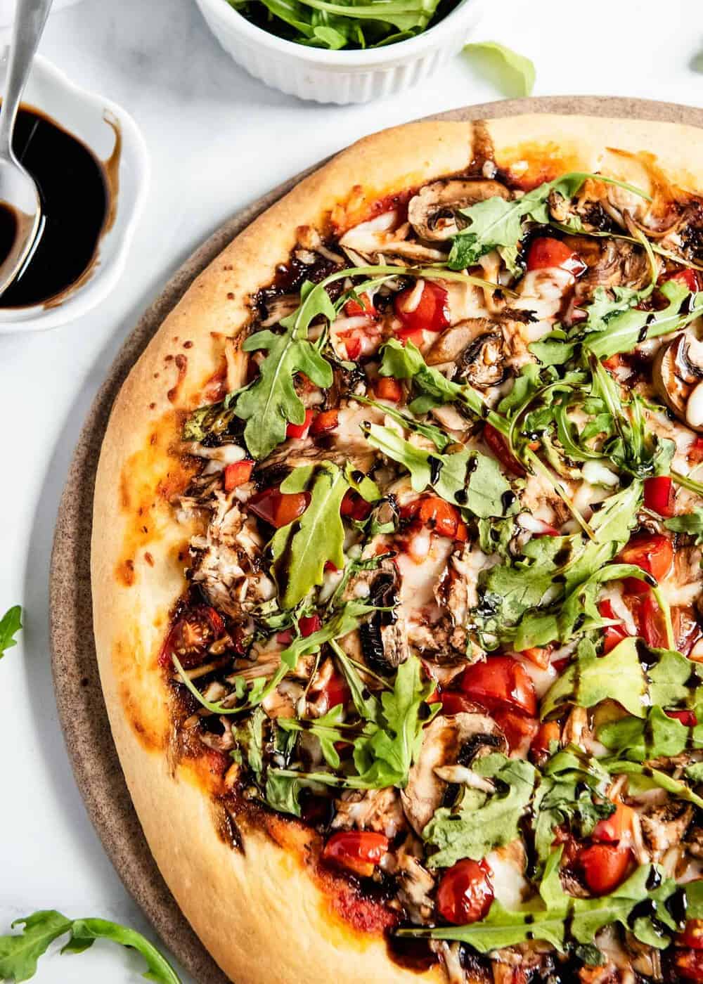 Healthy pizza with vegetables and arugula