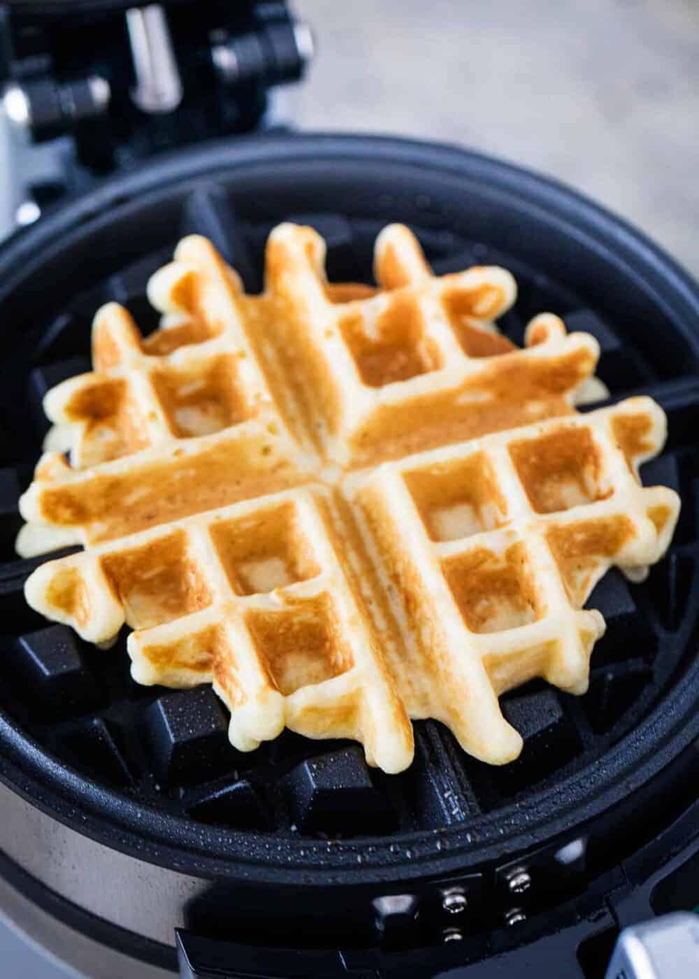 Homemade waffles on waffle iron.