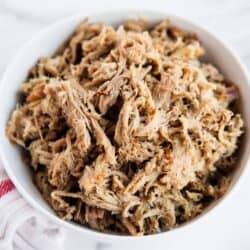 shredded kalua pork in a white bowl