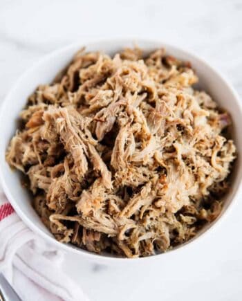 shredded kalua pork in a white bowl