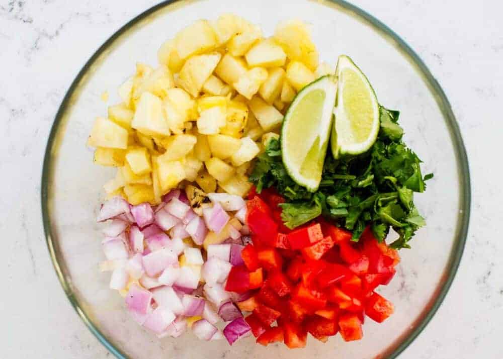 Pineapple salsa ingredients in a bowl.
