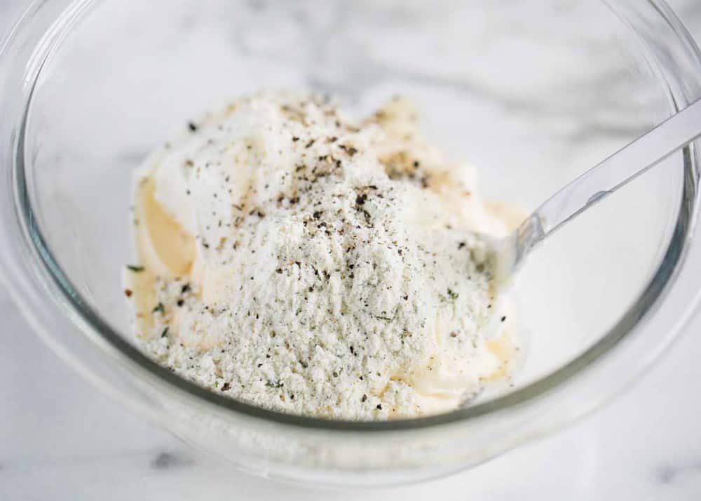 Potato salad seasoning in a glass bowl.