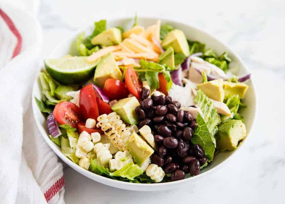 Chicken taco salad in white bowl.