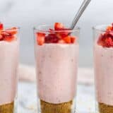 strawberry mousse in glass cup with spoon