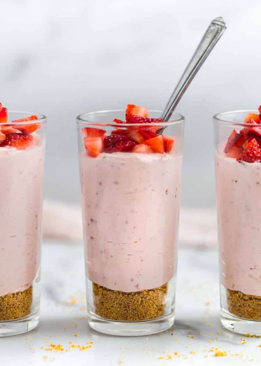 strawberry mousse in glass cup with spoon
