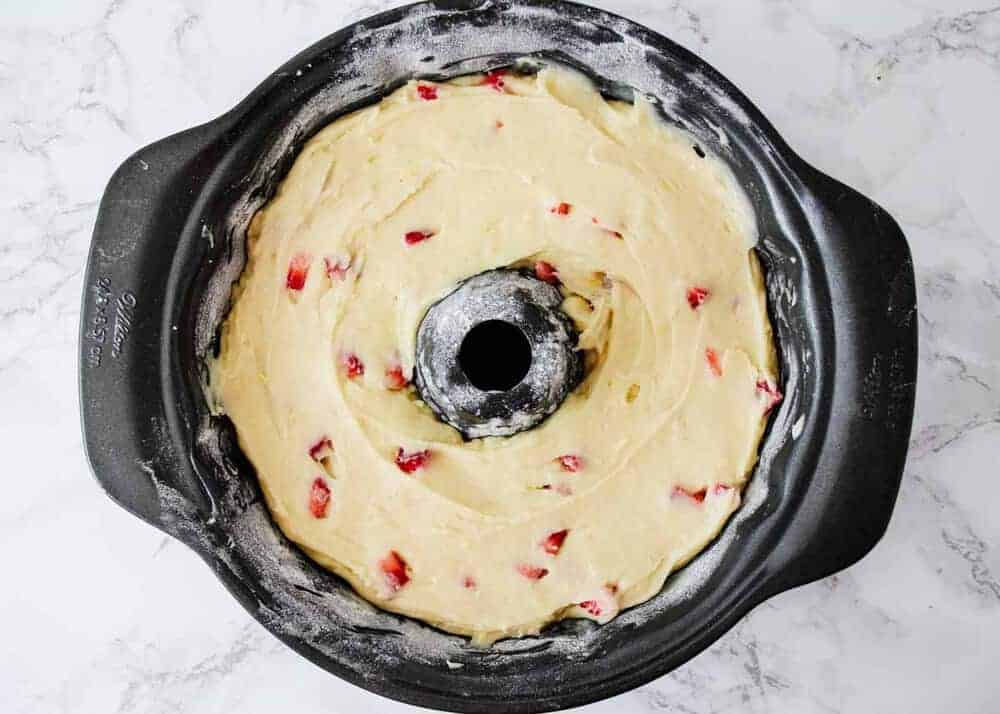 Strawberry sour cream batter in bundt pan.