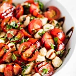 tomato basil mozzarella salad in white bowl